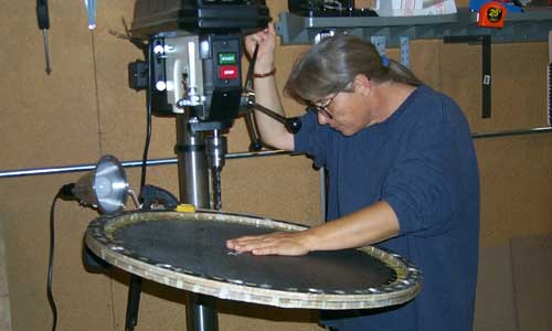 Sue drilling holes in plate